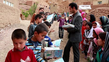 Saber Hosseini handing out The Stranger's Farewell to Afghan children