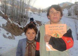 2 Afghan boys with the book Fatima the Spinner and the Tent
