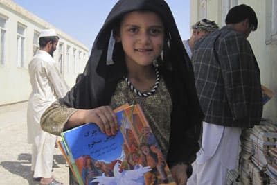 Afghan girl with Hoopoe Books