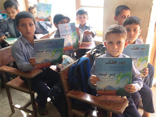 Afghan boys in a classroom with Neem the Half-Boy