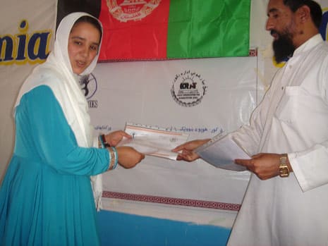Teacher receiving certificate of completion