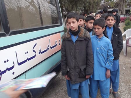 Students in Jalalabad waiting in line for their Hoopoe Books