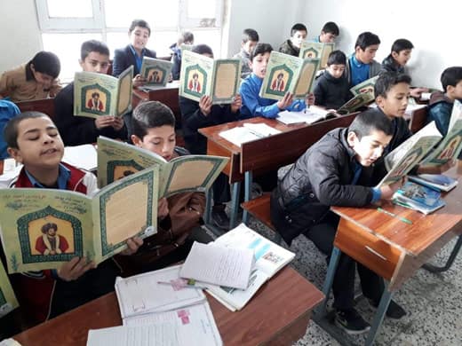 Afghan children in class with Hoopoe books