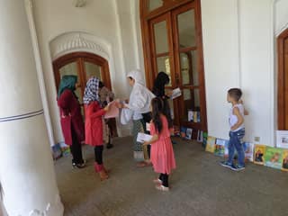 Kids with Hoopoe books at International Literacy Day event in Afghanistan