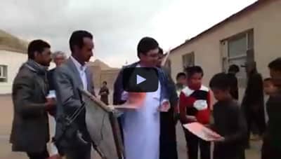 Mr. Hosseini and Governor of Bamyan province distributing books, YouTube video