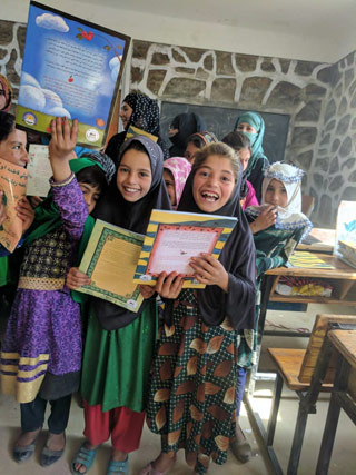 Afghan girls in classroom with Hoopoe books