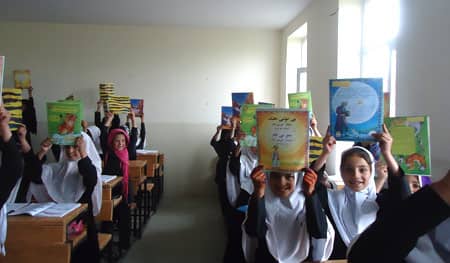 girls with Hoopoe Books in school in the village of Bojasar 