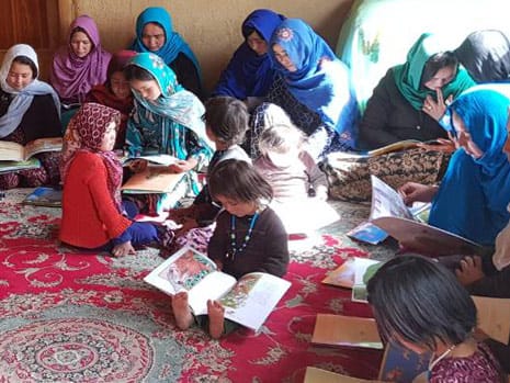 Reading Hoopoe books in a Hazara village sitting room