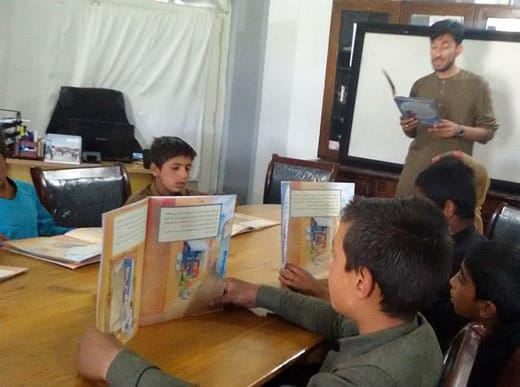 Afghan boys with Hoopoe books thanks to Aschiana