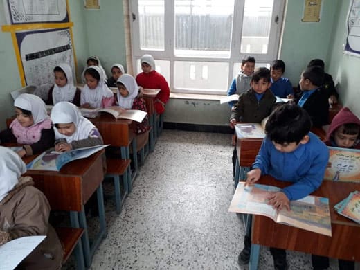 Afghan children in class with Hoopoe books